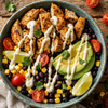 Healthy chicken taco bowl with cottage cheese sauce, rice, beans, and avocado